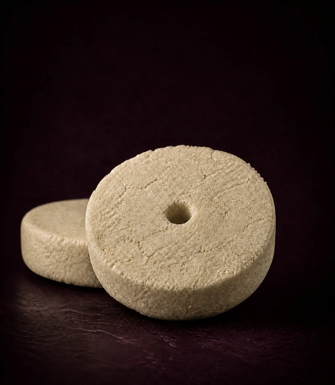 Pressed sake lees cakes — the fermented rice residue behind VINATA's patented Sake Lees Yeast Extract